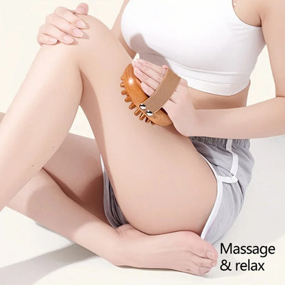 Woman using wooden massage brush for leg relaxation and muscle relief
